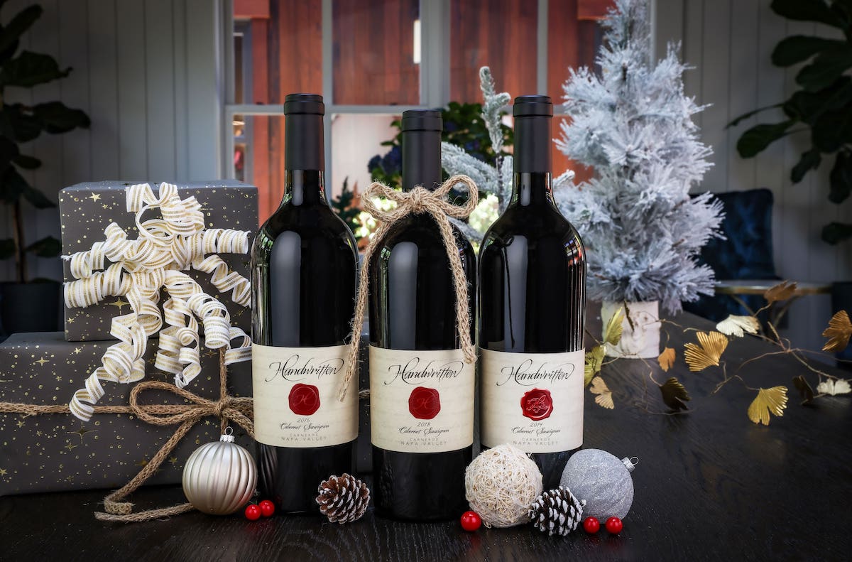 three wine bottle son festive table