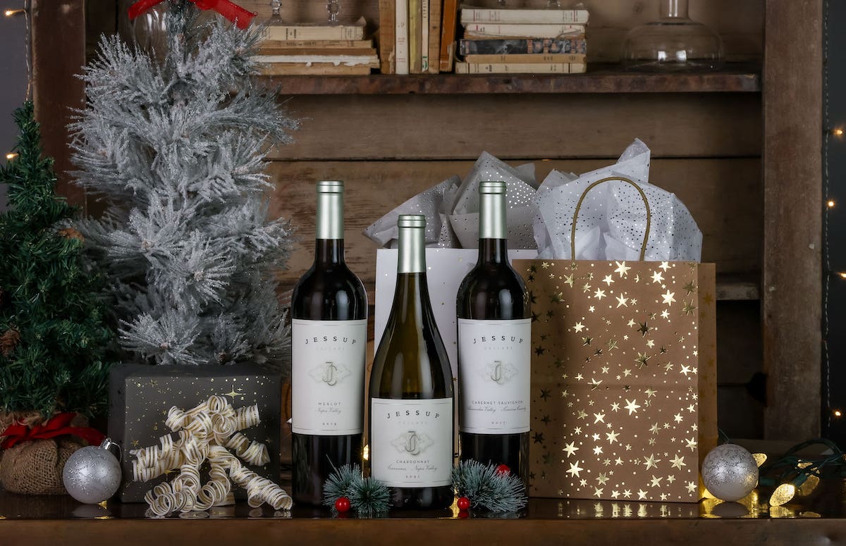 three bottles of wine on festive table