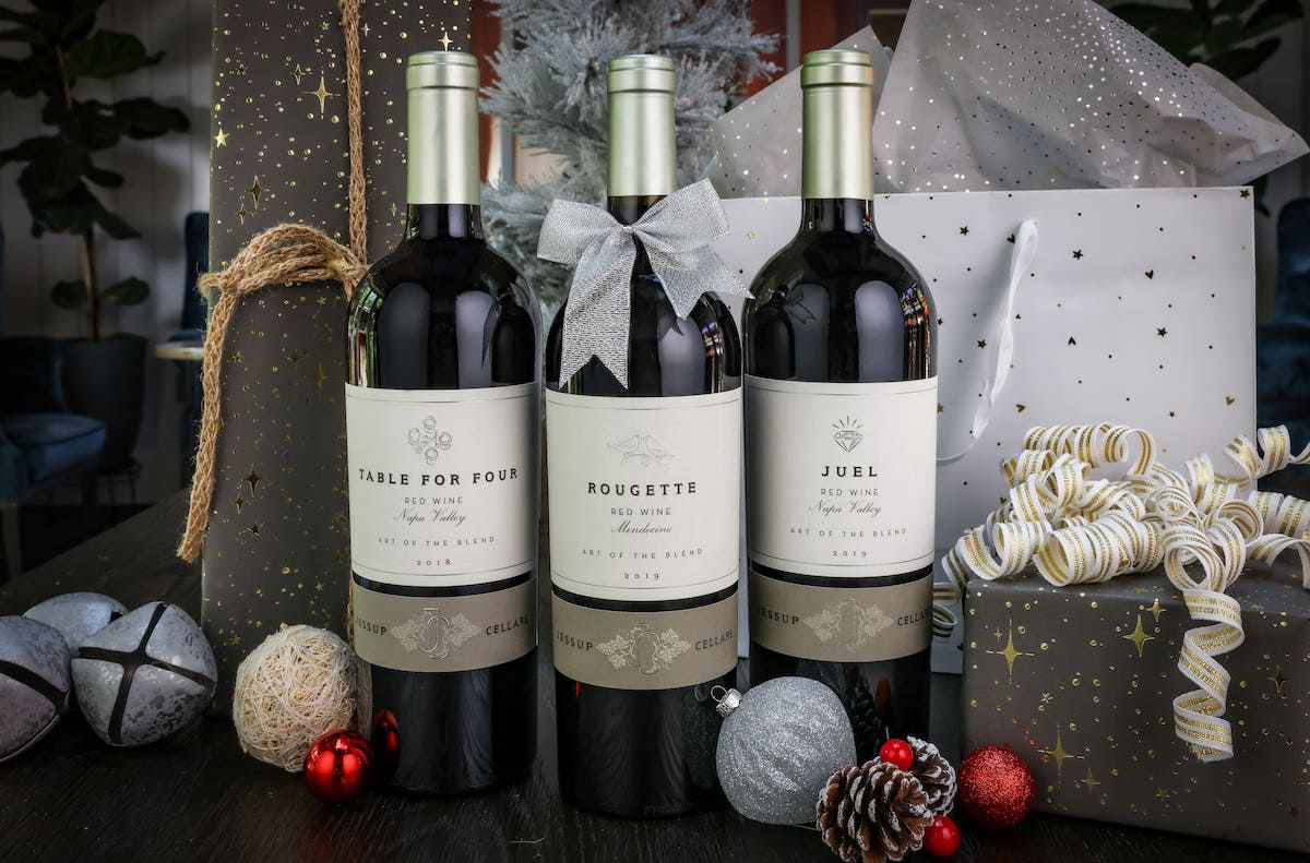 three bottles of wine on festive table