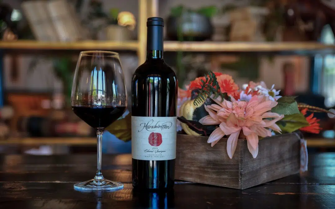 Yountville Cabernet Sauvignon with flowers and glass of wine