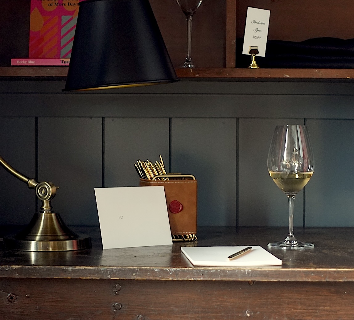 letter and champagne glass on desk