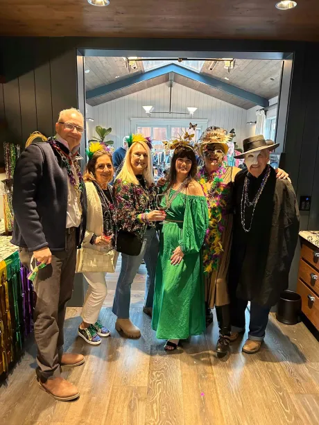 group of friends celebrating Mardi Gras at Handwritten Wines